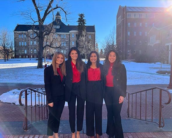 Four students pose for a photo after winning the National Diversity Case Competition